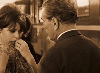 Movie still from “Daisies” (1966), directed by Vera Chytilová – An older man and a young girl looking at each other; Medium shot, Over the shoulder angle