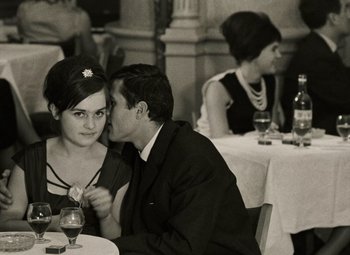 Movie still from “Daisies” (1966), directed by Vera Chytilová – A man and a woman sitting at a dinner table; Close Up shot, Over the shoulder angle