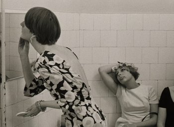 Movie still from “Daisies” (1966), directed by Vera Chytilová – Two women in a bathroom , one of which has her hair in her hand; Close Up shot, Over the shoulder angle