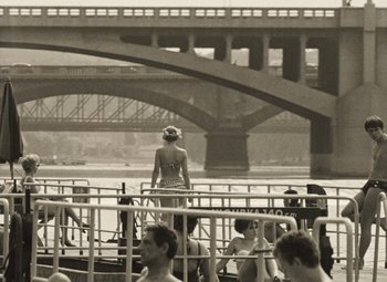 Movie still from “Daisies” (1966), directed by Vera Chytilová – A black and white photo of a woman standing on a boat; Wide shot, High angle