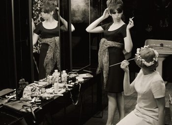 Movie still from “Daisies” (1966), directed by Vera Chytilová – A black and white photo of a woman in front of a mirror; Medium shot, Over the shoulder angle