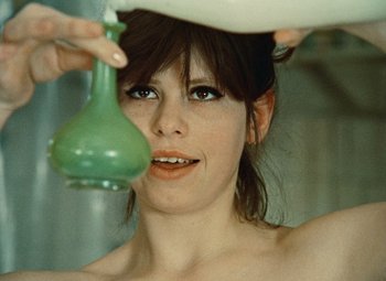 Movie still from “Daisies” (1966), directed by Vera Chytilová – A woman is taking a bath in the tub; Close Up shot, Overhead angle