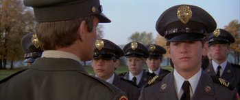 Movie still from “Damien: Omen II” (1978), directed by Mike Hodges – A group of young men in military uniforms standing next to each other; Close Up shot, Over the shoulder angle