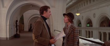 Movie still from “Damien: Omen II” (1978), directed by Mike Hodges – A man and a woman talking to each other; Medium shot, Low angle