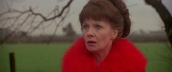 Movie still from “Damien: Omen II” (1978), directed by Mike Hodges – A person wearing a red jacket; Close Up shot, Low angle