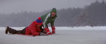 Movie still from “Damien: Omen II” (1978), directed by Mike Hodges – Two boys are playing in the snow on their snow boards; Wide shot, High angle