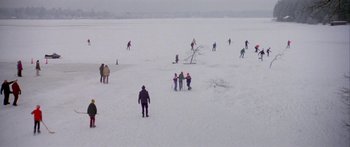 Movie still from “Damien: Omen II” (1978), directed by Mike Hodges – A number of people on skis in the snow; Extreme Wide shot, High angle