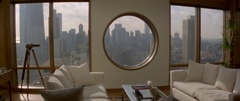 Movie still from “Damien: Omen II” (1978), directed by Mike Hodges – A living room with a view of the city; Wide shot, High angle