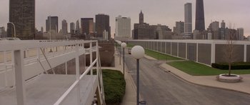 Movie still from “Damien: Omen II” (1978), directed by Mike Hodges – A view of a city from a walkway; Extreme Wide shot, High angle