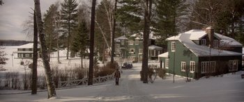 Movie still from “Damien: Omen II” (1978), directed by Mike Hodges – A person is walking down a path in the snow; Extreme Wide shot, High angle