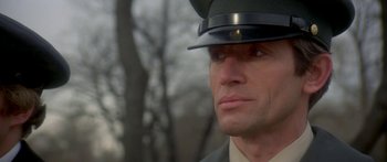 Movie still from “Damien: Omen II” (1978), directed by Mike Hodges – A person wearing a hat; Close Up shot, Low angle