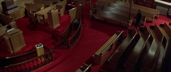 Movie still from “Damien: Omen II” (1978), directed by Mike Hodges – An overhead view of a red carpet in a church; Extreme Wide shot, High angle
