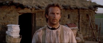 Movie still from “Dances with Wolves” (1990), directed by Kevin Costner – A person wearing a shirt and tie; Close Up shot, Low angle