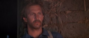 Movie still from “Dances with Wolves” (1990), directed by Kevin Costner – A person wearing a blue shirt; Close Up shot, Low angle