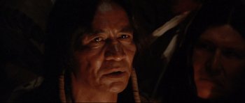Movie still from “Dances with Wolves” (1990), directed by Kevin Costner – An old man with a long hair and a beard; Close Up shot, Over the shoulder angle
