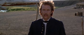 Movie still from “Dances with Wolves” (1990), directed by Kevin Costner – A person wearing a uniform; Close Up shot, Low angle