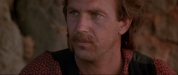 Movie still from “Dances with Wolves” (1990), directed by Kevin Costner – A person with a mustache; Close Up shot, Over the shoulder angle