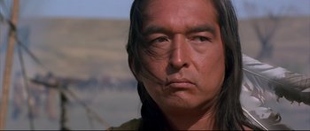 Movie still from “Dances with Wolves” (1990), directed by Kevin Costner – A person with long black hair; Close Up shot, Low angle