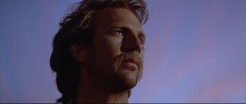 Movie still from “Dances with Wolves” (1990), directed by Kevin Costner – A person with a beard looking up; Close Up shot, Low angle