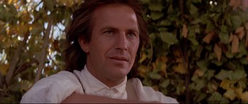 Movie still from “Dances with Wolves” (1990), directed by Kevin Costner – A person with long hair; Close Up shot, Low angle