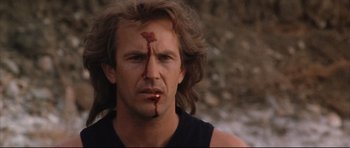 Movie still from “Dances with Wolves” (1990), directed by Kevin Costner – A person with blood on his face; Close Up shot, Low angle