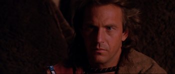 Movie still from “Dances with Wolves” (1990), directed by Kevin Costner – A person wearing a neck brace; Close Up shot, Low angle
