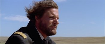 Movie still from “Dances with Wolves” (1990), directed by Kevin Costner – A person wearing a suit and tie; Close Up shot, Low angle