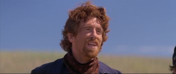 Movie still from “Dances with Wolves” (1990), directed by Kevin Costner – A person wearing a scarf; Close Up shot, Low angle