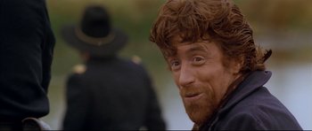 Movie still from “Dances with Wolves” (1990), directed by Kevin Costner – A person with a beard and mustache; Close Up shot, Over the shoulder angle