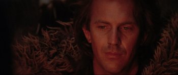 Movie still from “Dances with Wolves” (1990), directed by Kevin Costner – A man's face in the dark; Close Up shot, Low angle