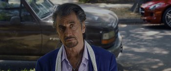 Movie still from “Danny Collins” (2015), directed by Dan Fogelman – An older man in a blue jacket and a white scarf; Close Up shot, Over the shoulder angle
