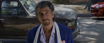 Movie still from “Danny Collins” (2015), directed by Dan Fogelman – An older man wearing a blue jacket and a pink tie; Close Up shot, Over the shoulder angle