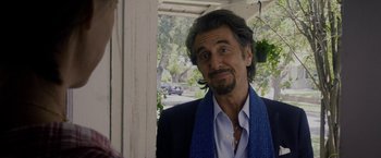 Movie still from “Danny Collins” (2015), directed by Dan Fogelman – A person wearing a suit and tie; Close Up shot, Over the shoulder angle
