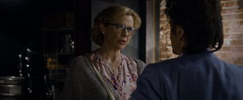Movie still from “Danny Collins” (2015), directed by Dan Fogelman – An older woman wearing glasses looking at a man; Close Up shot, Over the shoulder angle