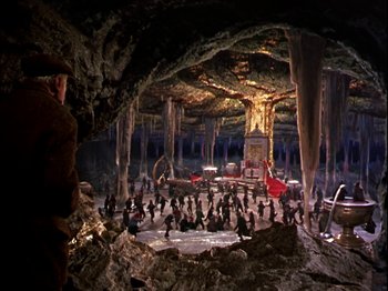 Movie still from “Darby O'Gill and the Little People” (1959), directed by Robert Stevenson – A group of people inside of a cave; Extreme Wide shot, High angle