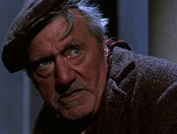 Movie still from “Darby O'Gill and the Little People” (1959), directed by Robert Stevenson – An older man with a hat and a beard; Close Up shot, High angle