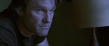 Movie still from “Dark Blue” (2002), directed by Ron Shelton – A person with blue eyes; Close Up shot, Low angle