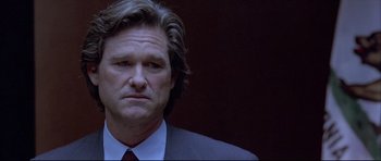 Movie still from “Dark Blue” (2002), directed by Ron Shelton – A person wearing a suit and tie; Close Up shot, Low angle