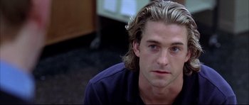 Movie still from “Dark Blue” (2002), directed by Ron Shelton – A person with long blonde hair; Close Up shot, Over the shoulder angle