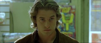 Movie still from “Dark Blue” (2002), directed by Ron Shelton – A person with long blonde hair; Close Up shot, Low angle