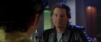 Movie still from “Dark Blue” (2002), directed by Ron Shelton – A man with long hair is looking at himself in the mirror; Close Up shot, Over the shoulder angle
