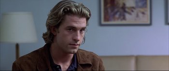 Movie still from “Dark Blue” (2002), directed by Ron Shelton – A person with long hair; Close Up shot, Over the shoulder angle