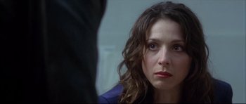Movie still from “Dark Blue” (2002), directed by Ron Shelton – A person with long brown hair; Close Up shot, Over the shoulder angle