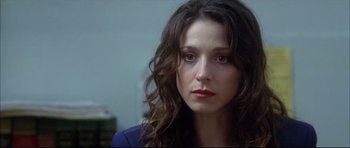 Movie still from “Dark Blue” (2002), directed by Ron Shelton – A person with long hair; Close Up shot, Over the shoulder angle