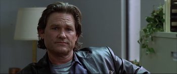 Movie still from “Dark Blue” (2002), directed by Ron Shelton – A person wearing a leather jacket; Close Up shot, Low angle