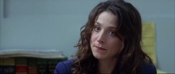 Movie still from “Dark Blue” (2002), directed by Ron Shelton – A person with long curly hair; Close Up shot, Over the shoulder angle