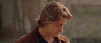 Movie still from “Dark Blue” (2002), directed by Ron Shelton – A person with long hair; Close Up shot, Over the shoulder angle
