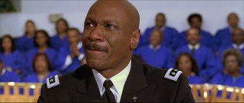 Movie still from “Dark Blue” (2002), directed by Ron Shelton – A person wearing a uniform; Close Up shot, Low angle