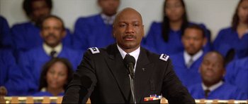 Movie still from “Dark Blue” (2002), directed by Ron Shelton – A man that is wearing a suit and tie; Close Up shot, Low angle