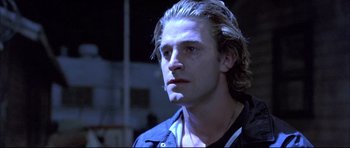 Movie still from “Dark Blue” (2002), directed by Ron Shelton – A person with long blonde hair; Close Up shot, Low angle